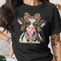 Black t-shirt with a cow wearing a leopard bow, glasses, and diamond necklace.