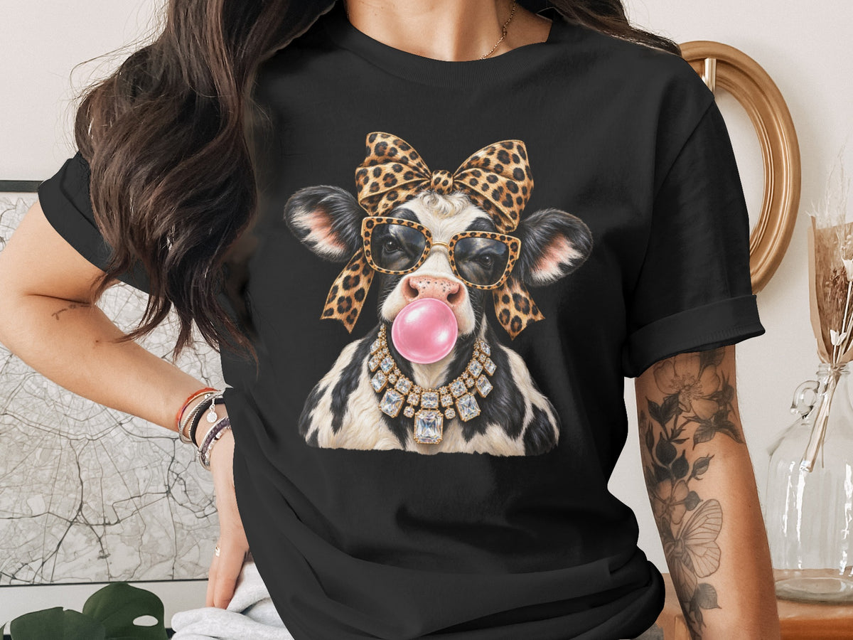 Black t-shirt with a cow wearing a leopard bow, glasses, and diamond necklace.