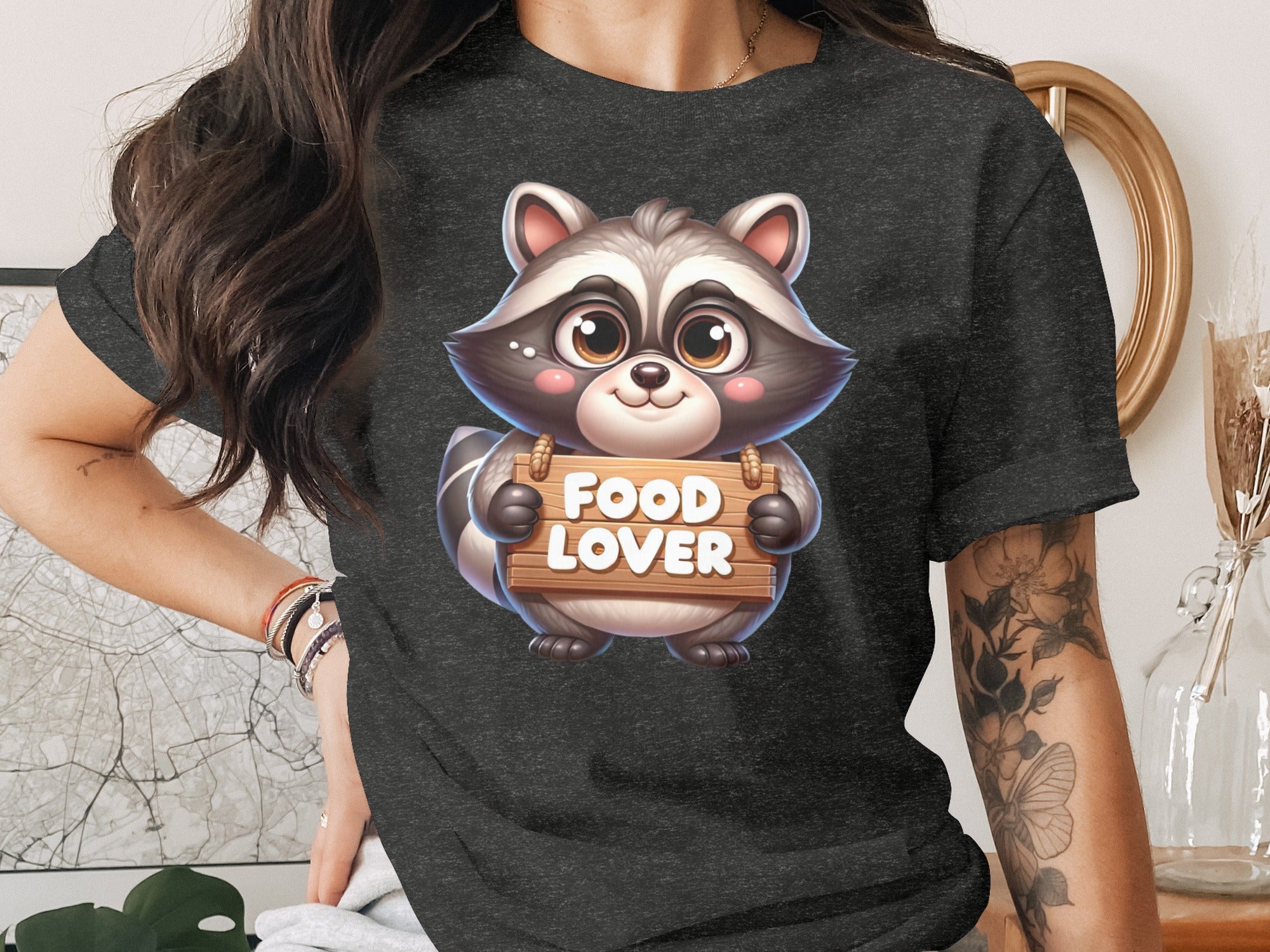 Cartoon raccoon holding a wooden sign with "FOOD LOVER" text.
