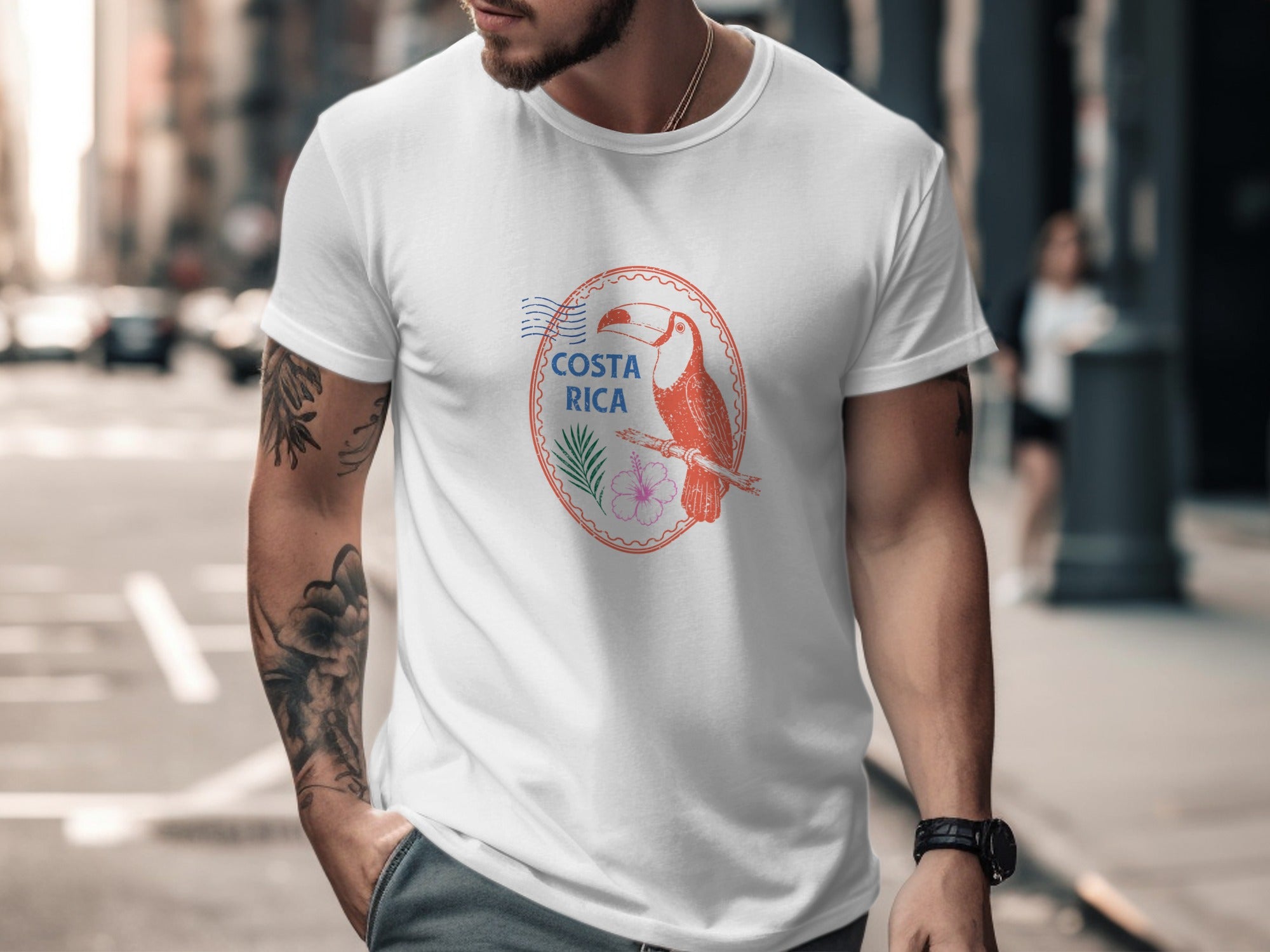 White t-shirt with a circular graphic of a toucan, palm frond, and flower, with "COSTA RICA" text.
