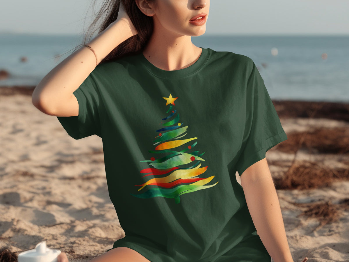 Dark green t-shirt with colorful abstract Christmas tree design on the front.