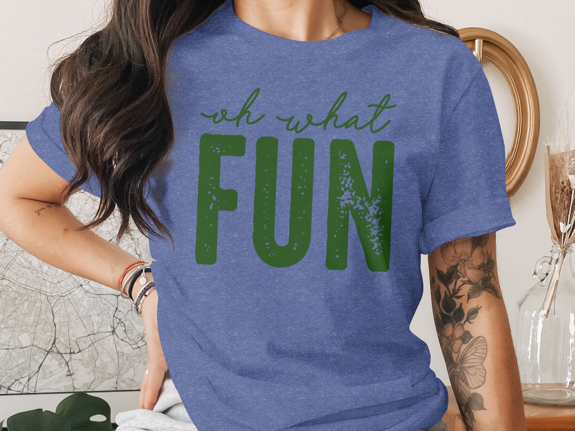 Blue t-shirt with green text reading "oh what FUN"