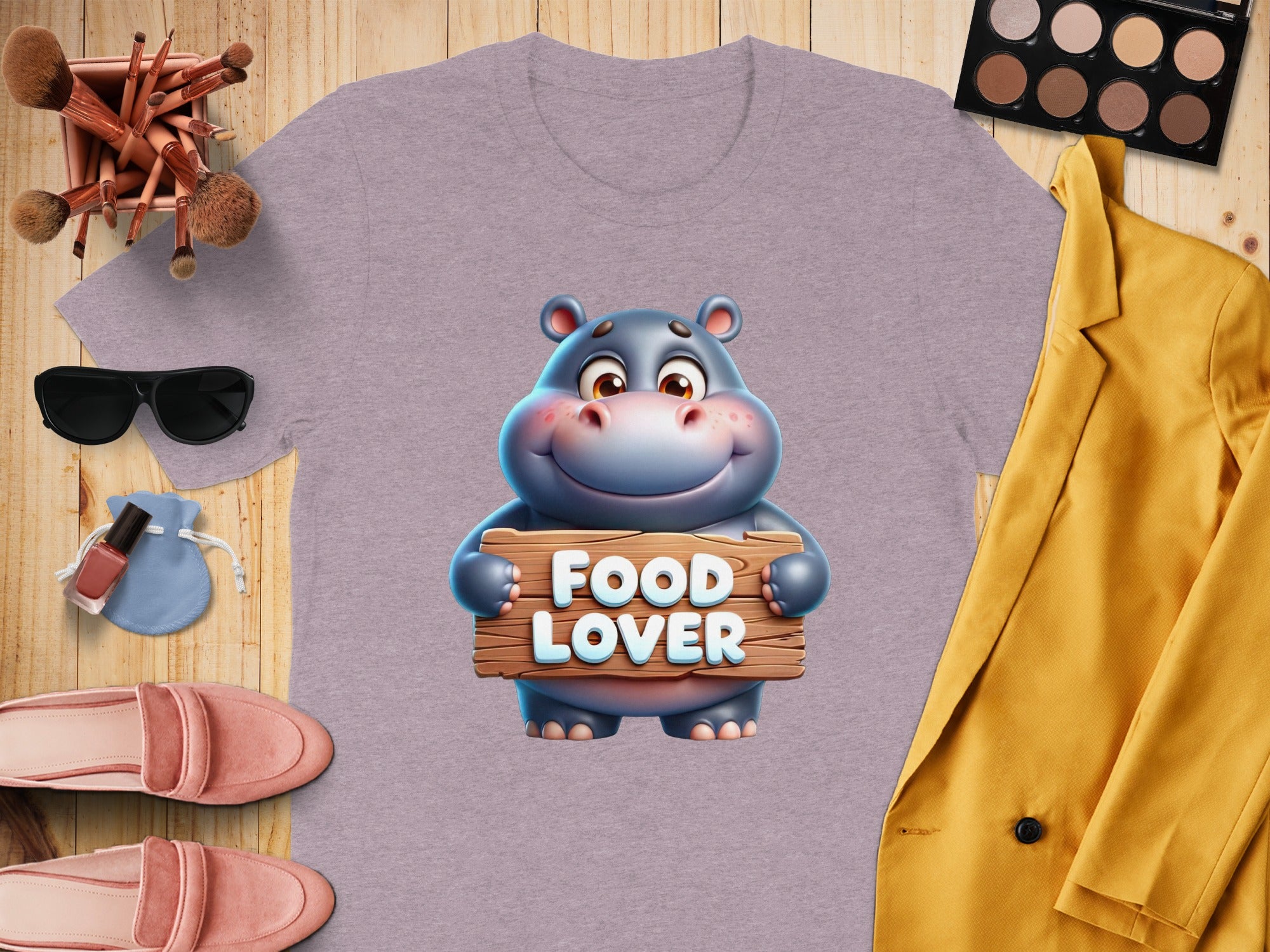 Purple t-shirt with cartoon hippo holding "FOOD LOVER" sign.