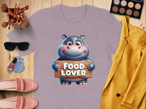 Purple t-shirt with cartoon hippo holding "FOOD LOVER" sign.