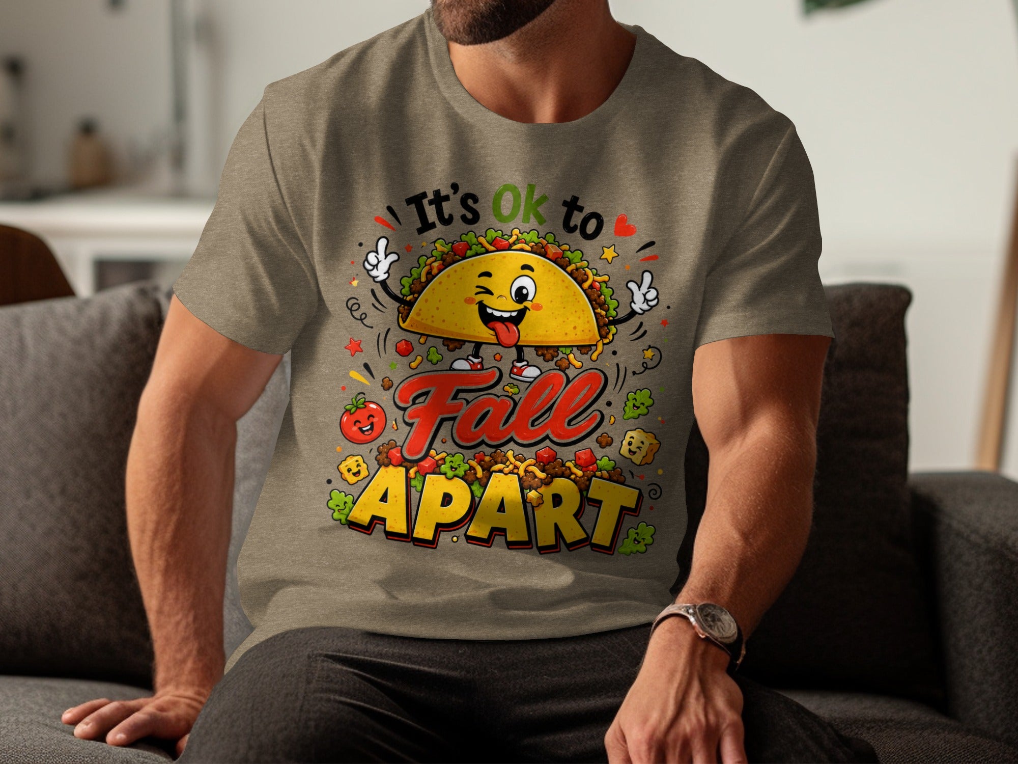 T-shirt graphic with cartoony taco saying "It's Ok to Fall Apart."