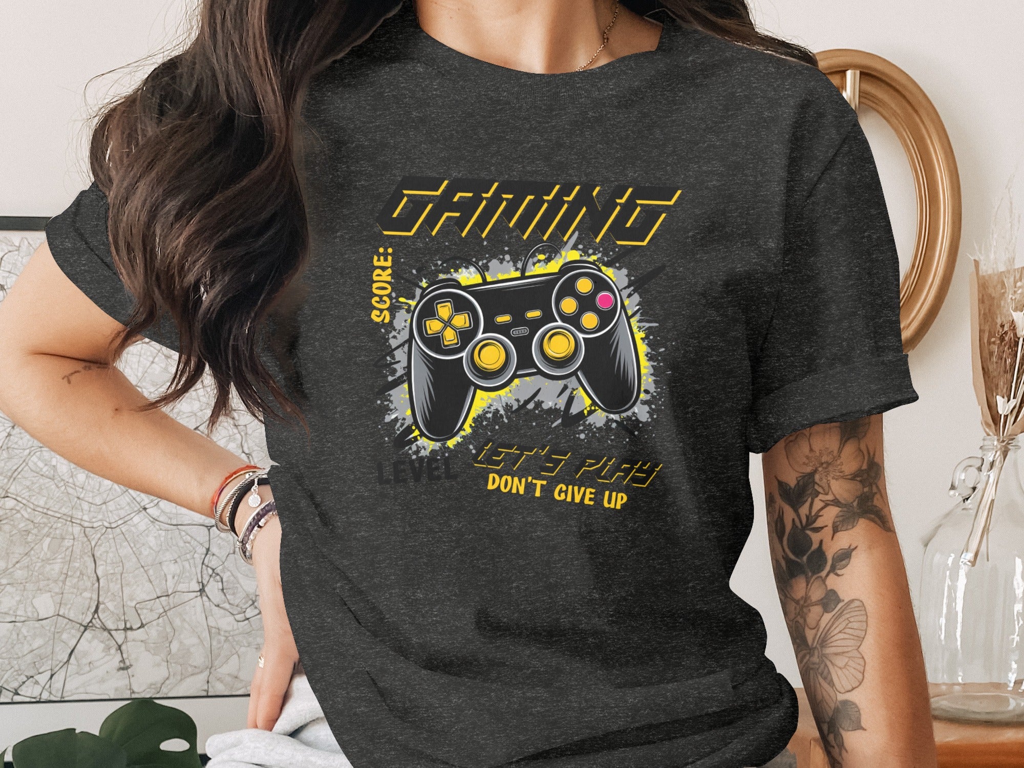 Dark grey t-shirt features a gaming controller graphic and text.