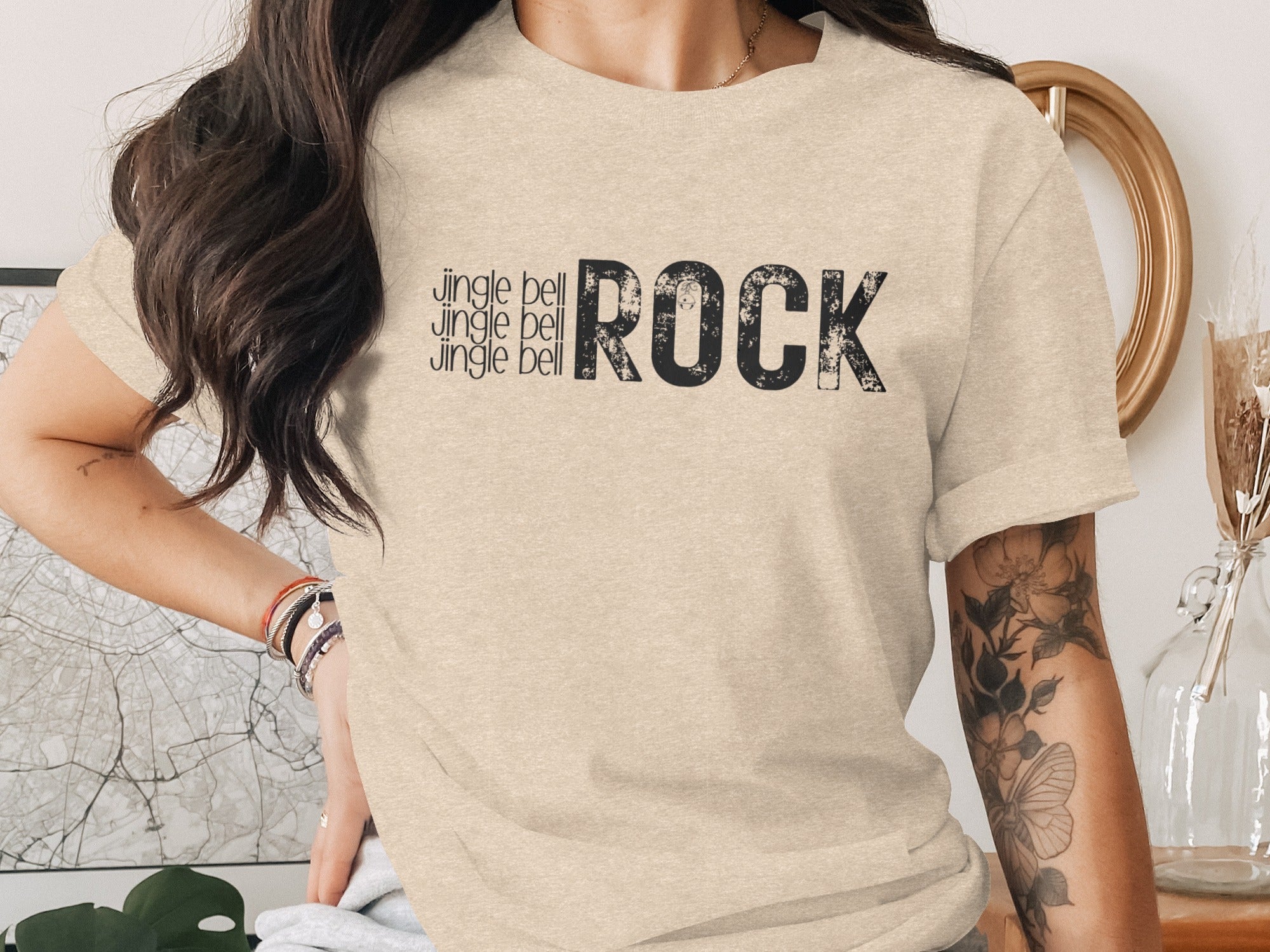 T-shirt with "Jingle bell" repeated three times and "ROCK" in distressed print.