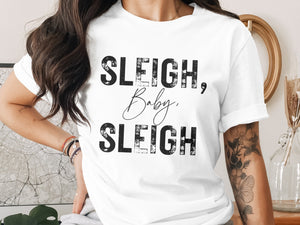 White t-shirt with black text: "SLEIGH, Baby, SLEIGH".