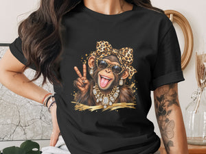 Chimpanzee wearing sunglasses, leopard print bow, and jewelry, holding up peace sign.