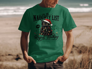 A man wearing a green t-shirt printed with a grumpy black cat tangled in Christmas lights.