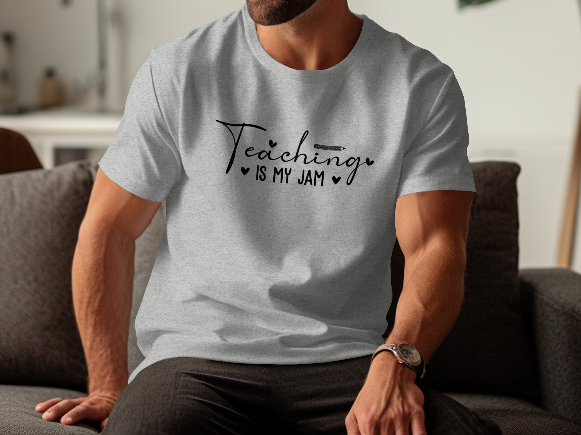 Grey t-shirt with "Teaching is my jam" text and pencil graphic.