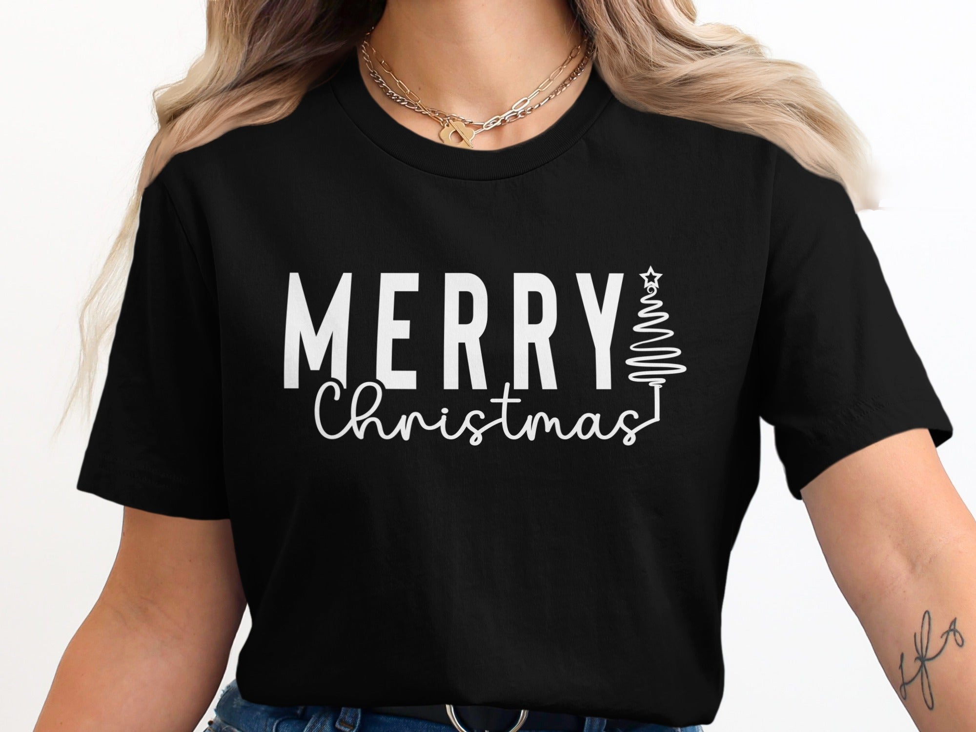 Black t-shirt with white text "Merry Christmas" and a line-art Christmas tree.