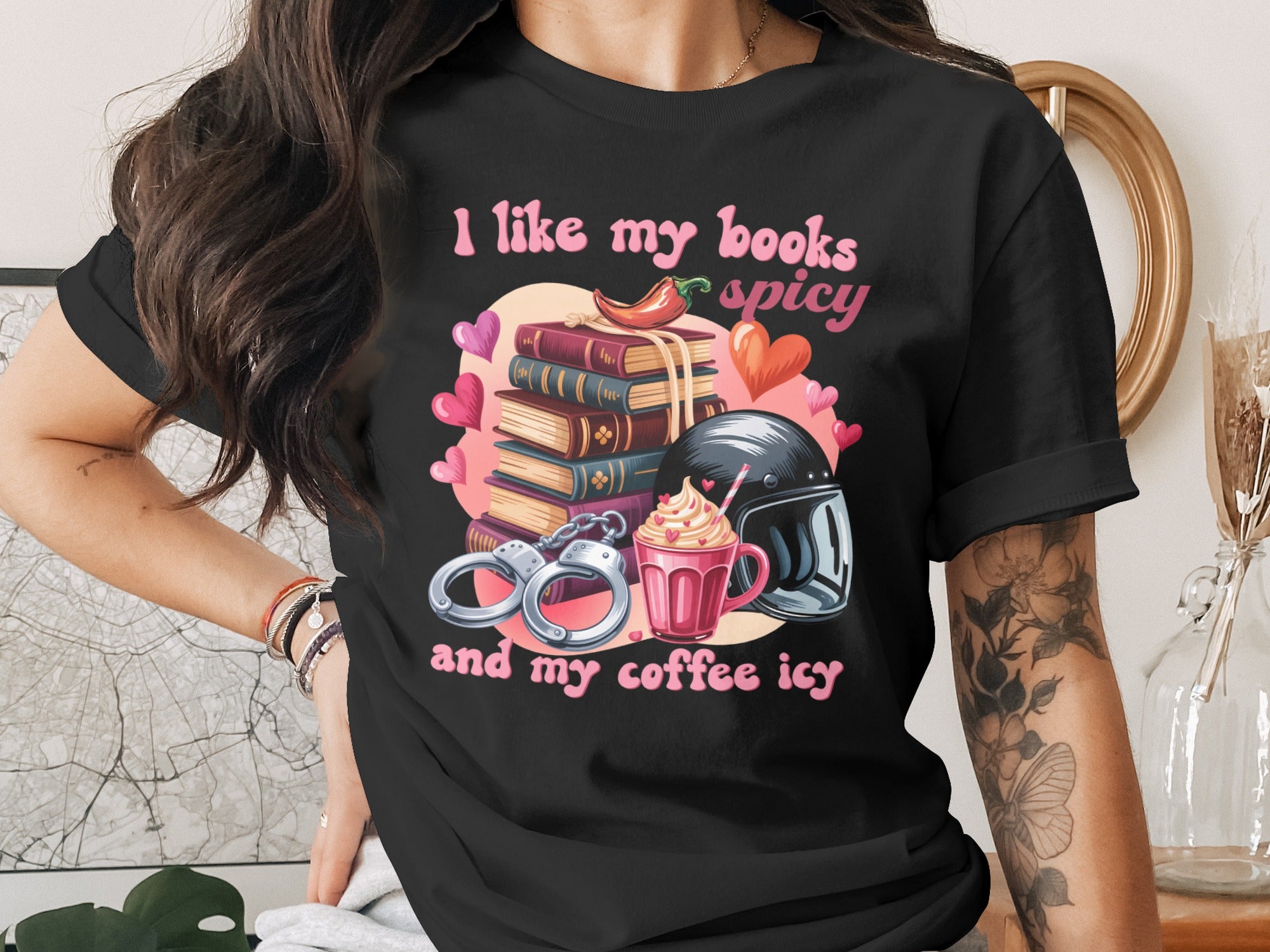 T-shirt with "I like my books spicy" and "and my coffee icy" text.