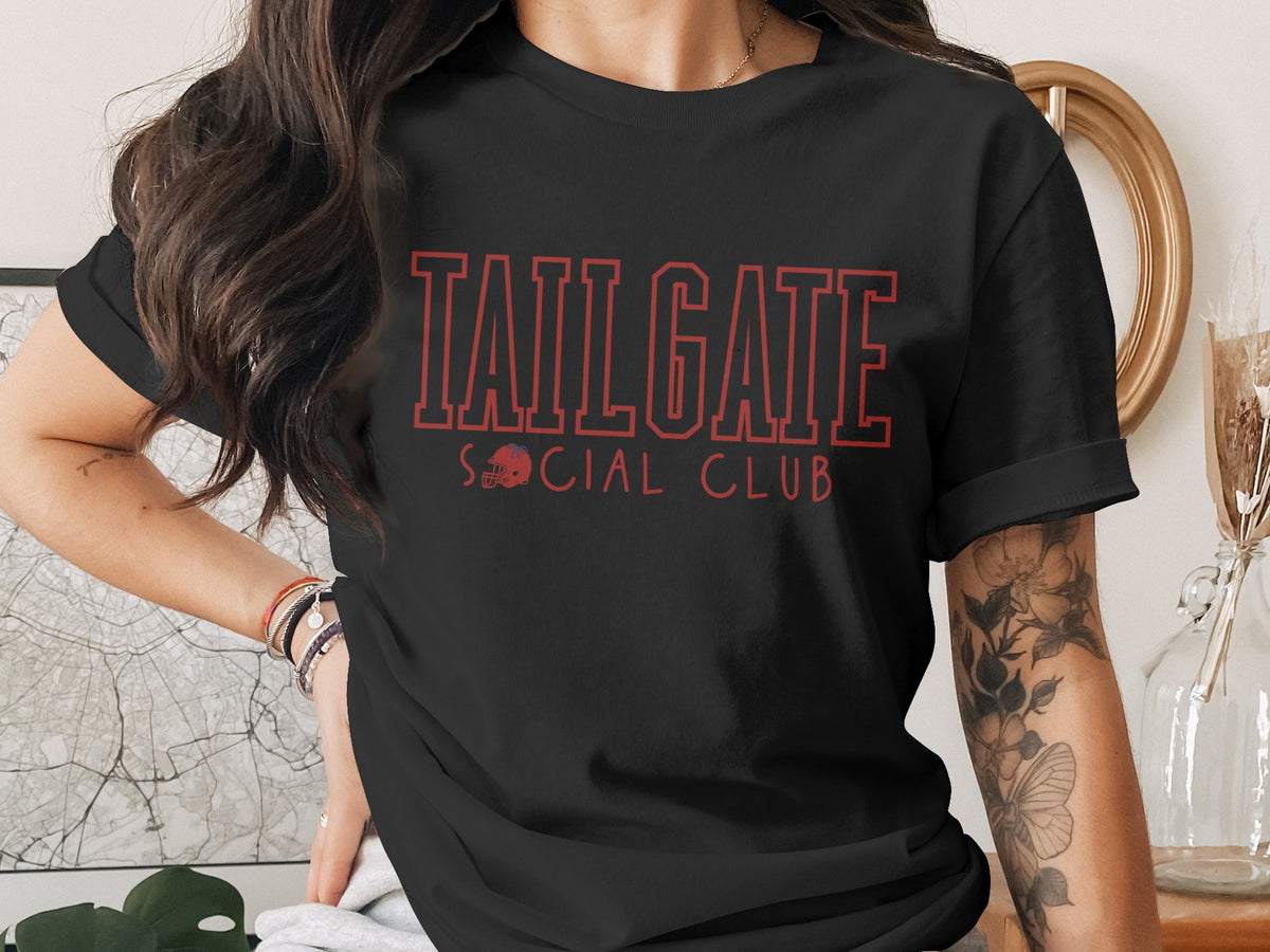 Black t-shirt with red "TAILGATE SOCIAL CLUB" text and a football helmet graphic.