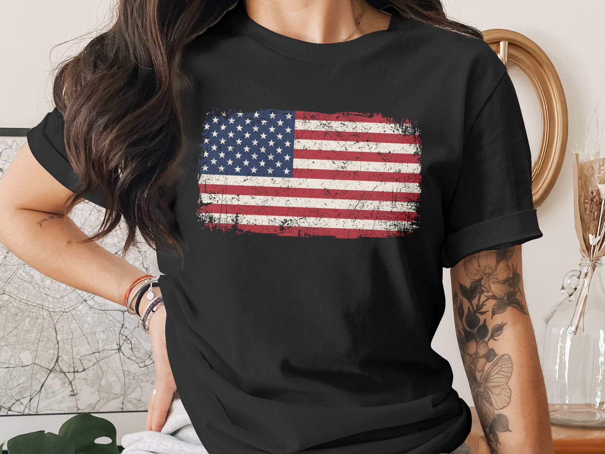 Black t-shirt with distressed American flag graphic on the chest.