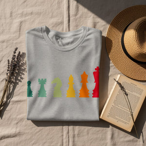 Grey t-shirt with a row of colorful chess pieces across the chest.