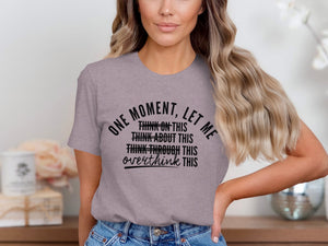 Gray t-shirt with black text: "One moment, let me overthink this."