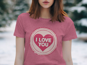 Pink t-shirt with a circular design featuring a pink heart and "I LOVE YOU" text.