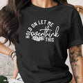 Black t-shirt with white text "Hold on let me overthink this"
