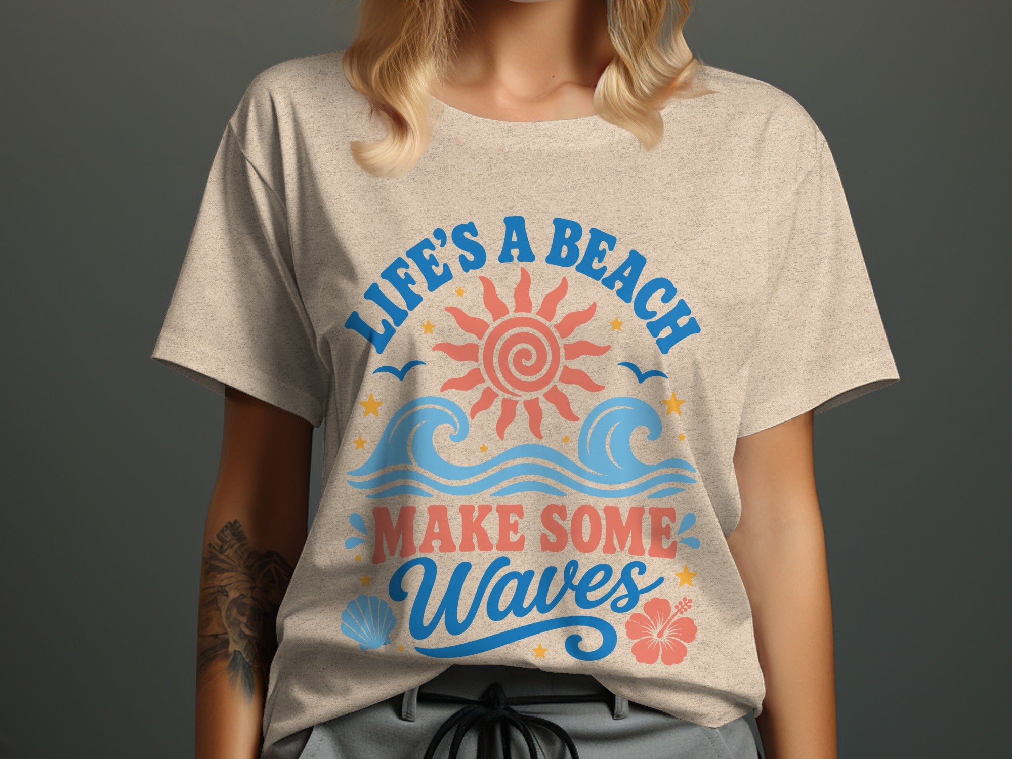 Light beige t-shirt with "LIFE'S A BEACH MAKE SOME Waves" text and beach graphics.