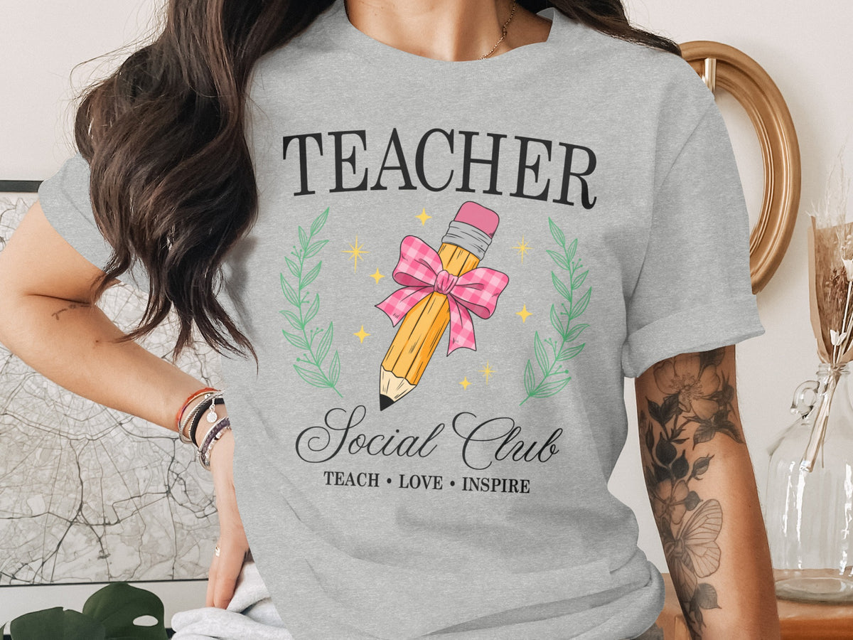 Grey t-shirt with "TEACHER Social Club" and pencil graphic.