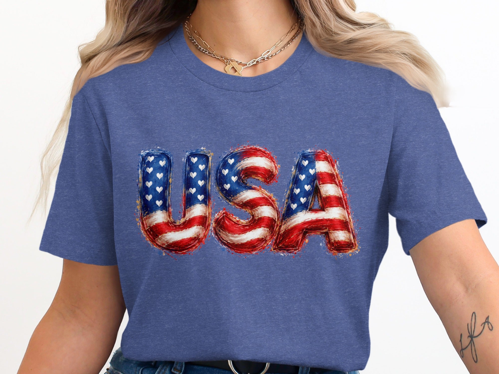 Blue t-shirt with "USA" text featuring American flag design.