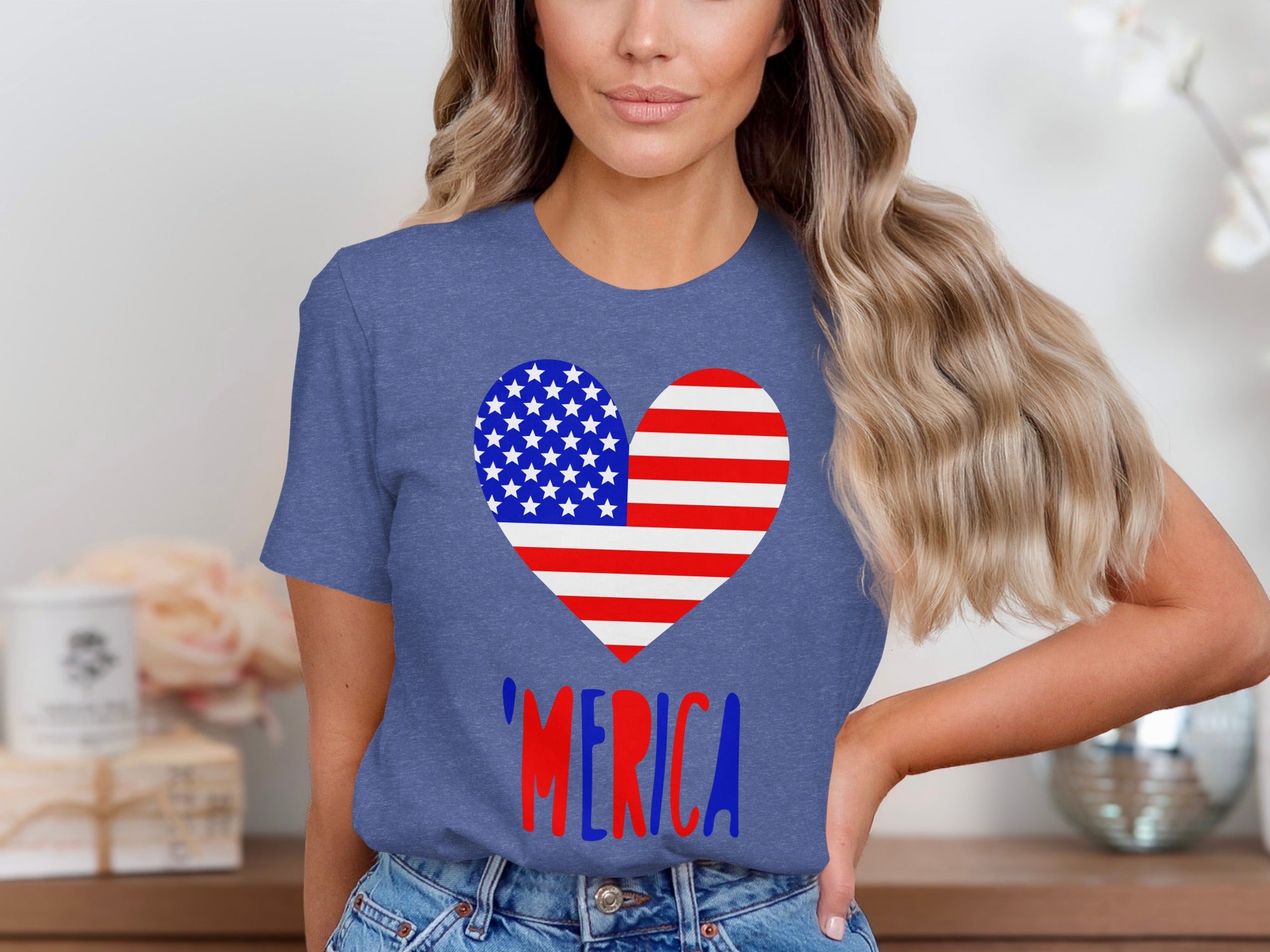 Blue t-shirt with American flag heart graphic and "MERICA" text.