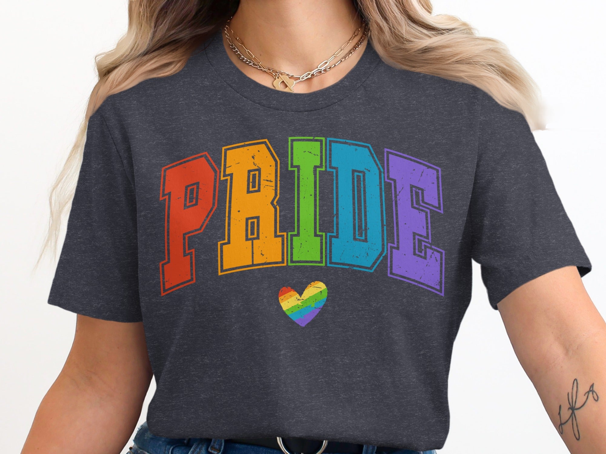 Dark grey t-shirt with rainbow "PRIDE" text and a rainbow heart.