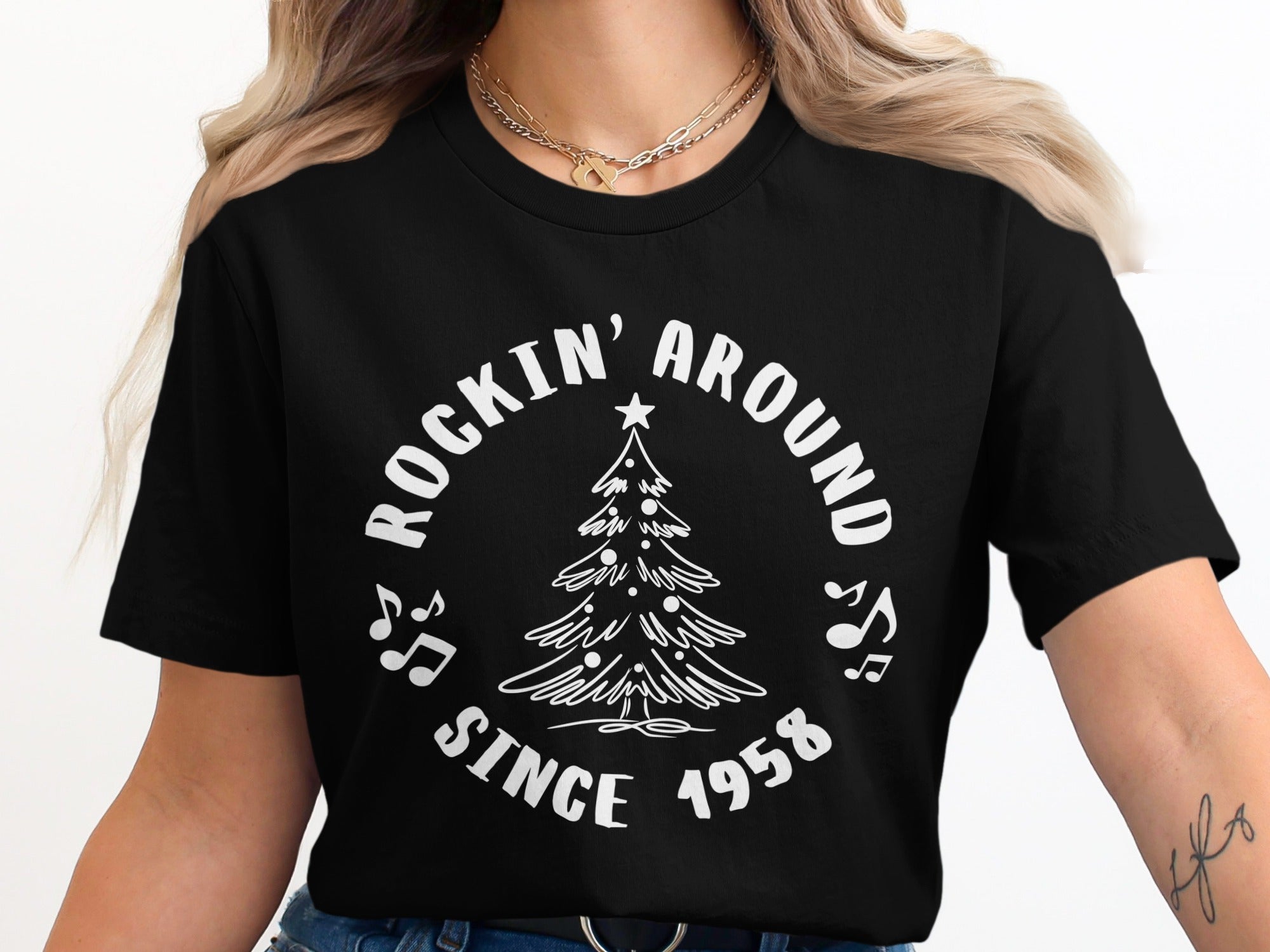 Black t-shirt with white text "Rockin' Around Since 1958" and a Christmas tree graphic.