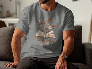 Grey t-shirt with an open book and flowers graphic, text \"book lover\".