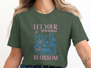 Green t-shirt with "LET YOUR dreams BLOSSOM" and cassette tape floral graphic.