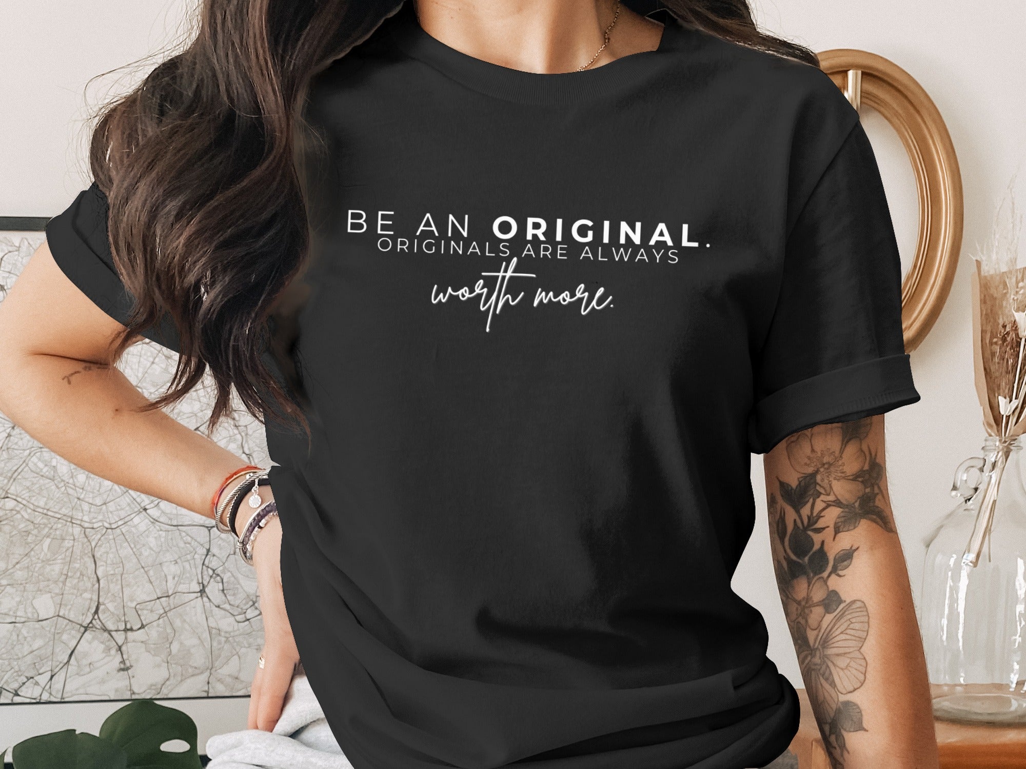 Black t-shirt with white text reading: BE AN ORIGINAL. ORIGINALS ARE ALWAYS worth more.