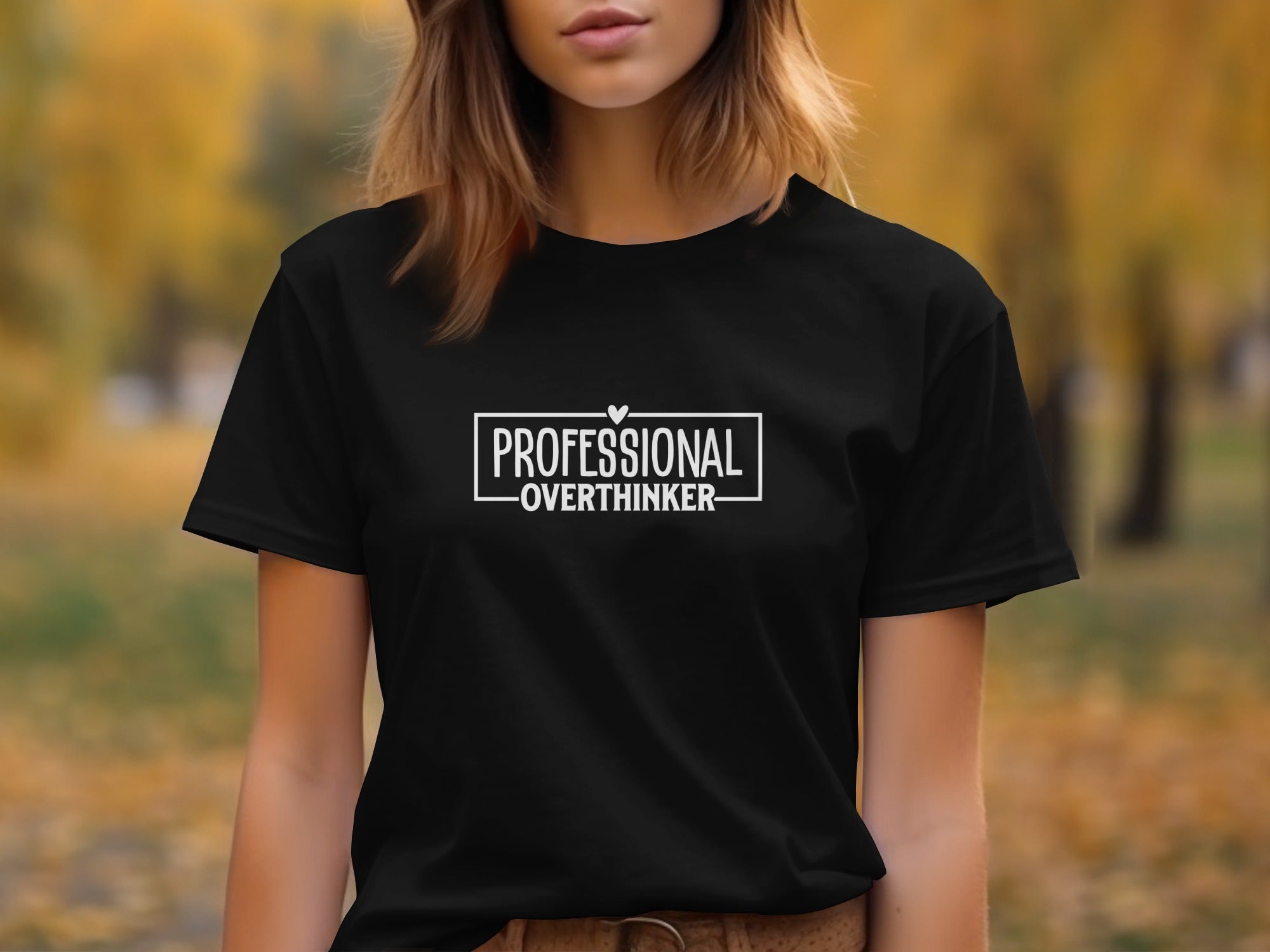 Black t-shirt with white text that reads "PROFESSIONAL OVERTHINKER" within a rectangle.