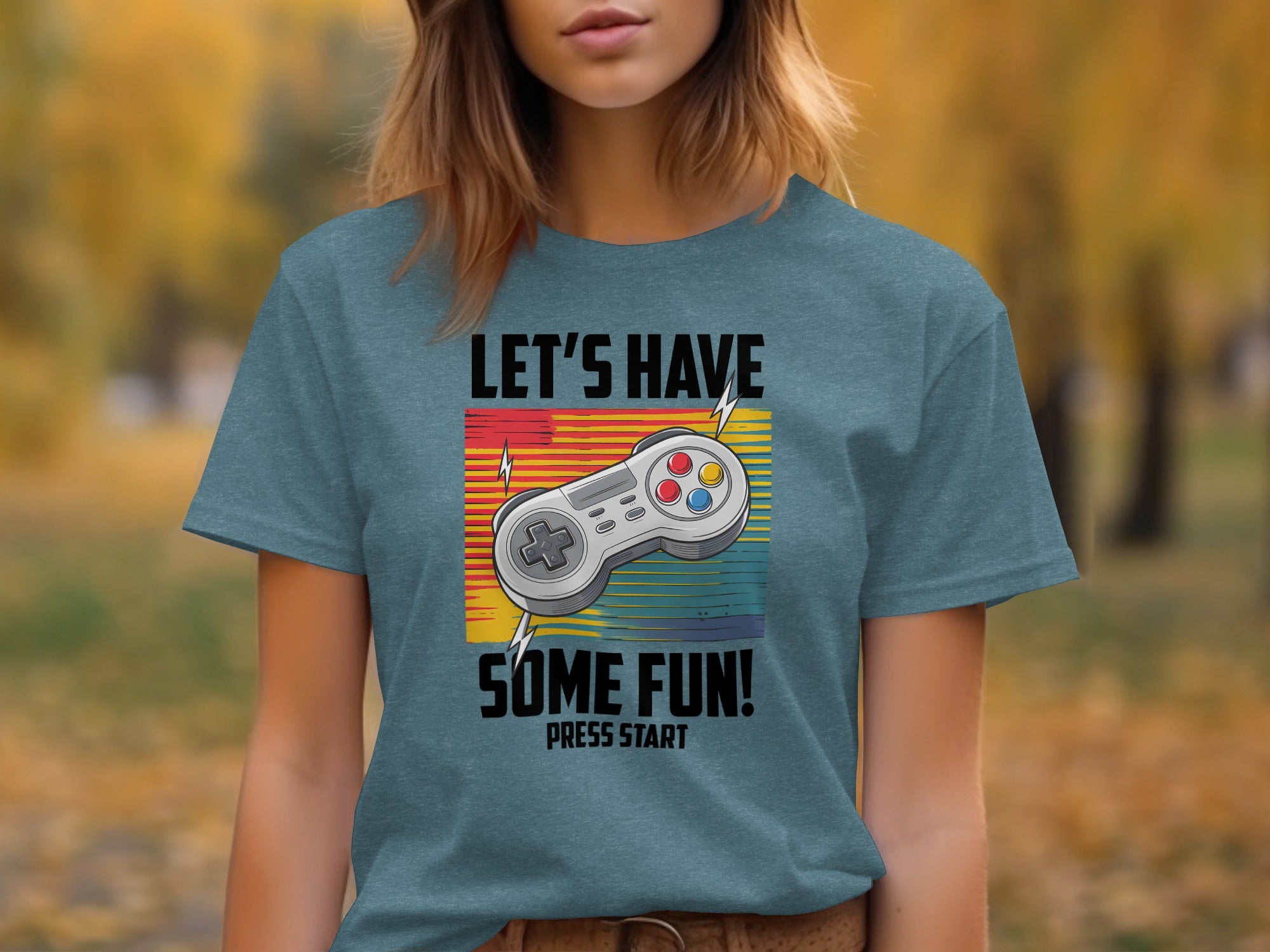 Graphic tee with a video game controller and "Let's Have Some Fun! Press Start" text.