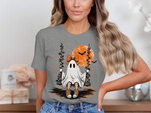 Ghost on a swing with a large moon and bats on a grey t-shirt.