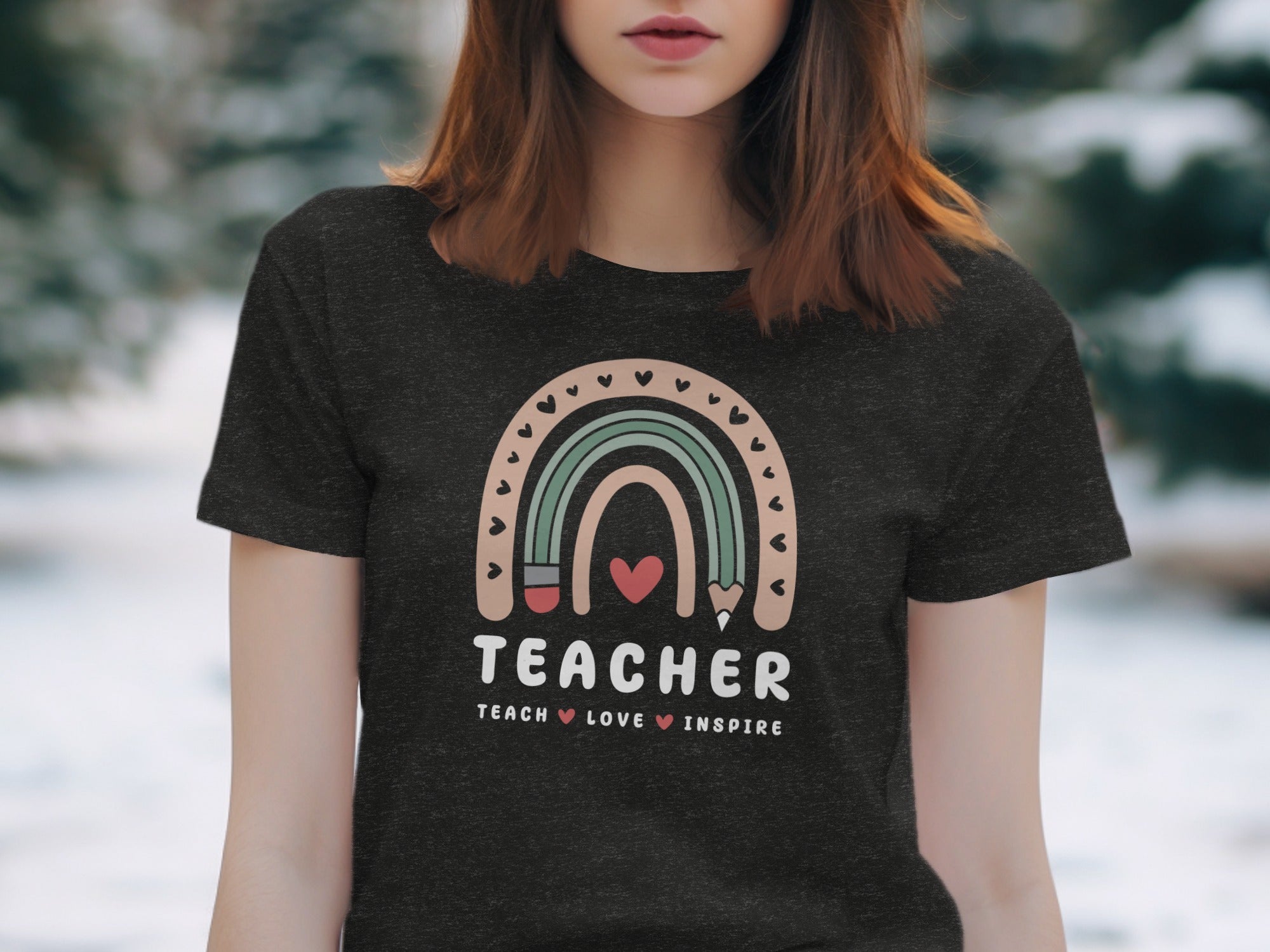 Dark t-shirt with "TEACHER TEACH LOVE INSPIRE" text and rainbow design.