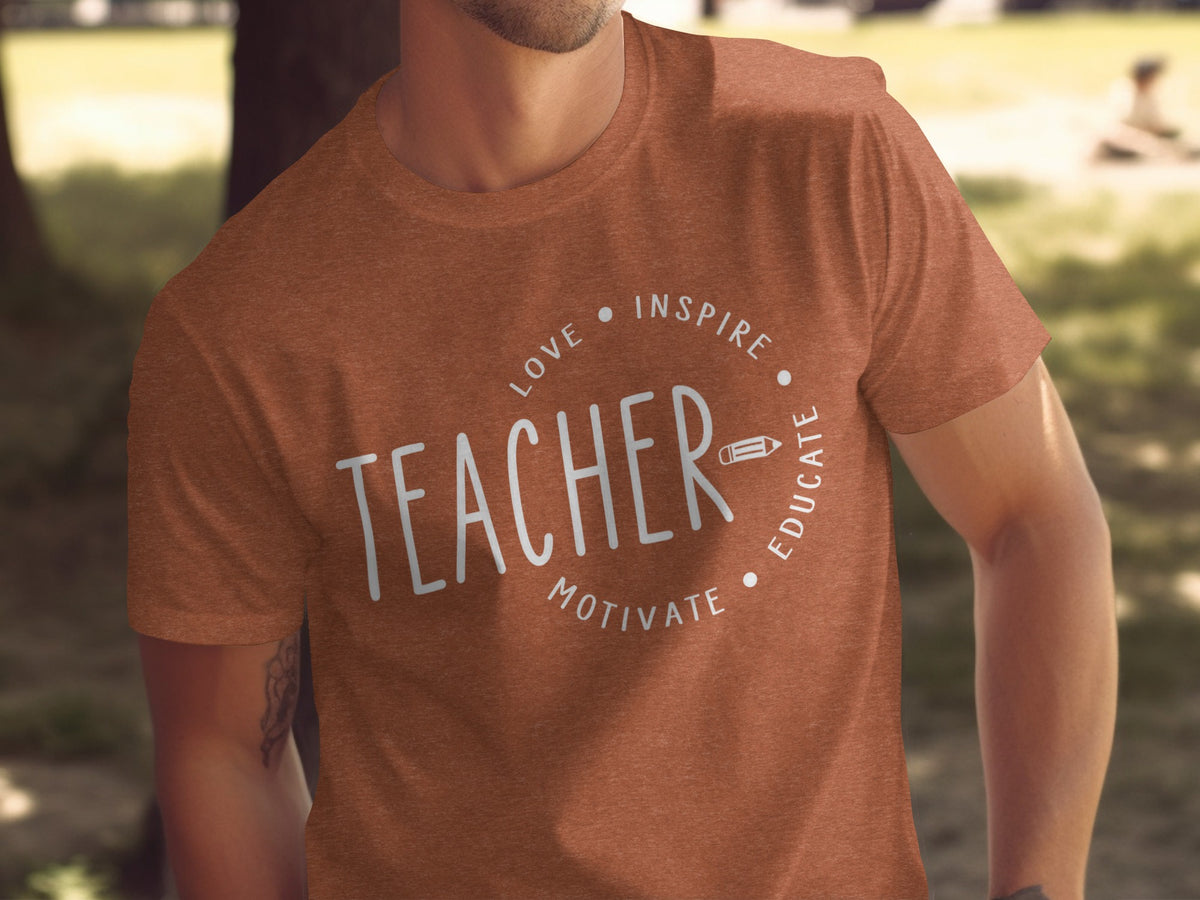 Orange t-shirt with "TEACHER" and "love, inspire, educate, motivate" text design.