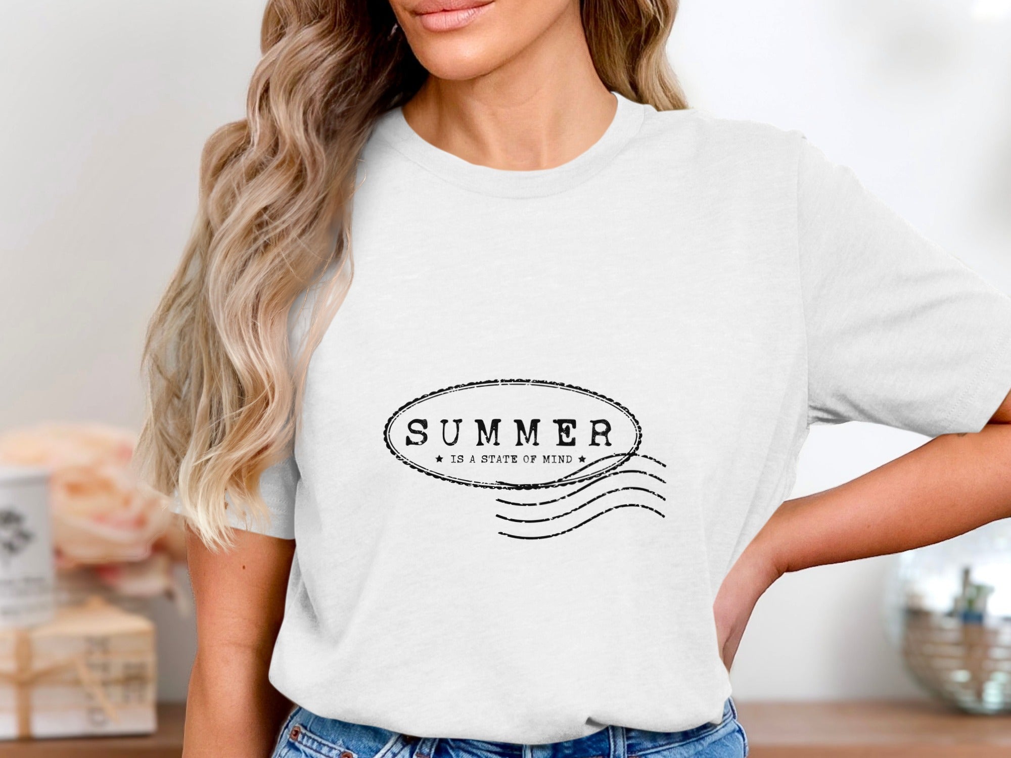 White t-shirt with black text: SUMMER IS A STATE OF MIND.