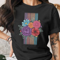 Black t-shirt with a colorful floral bouquet design and striped background.