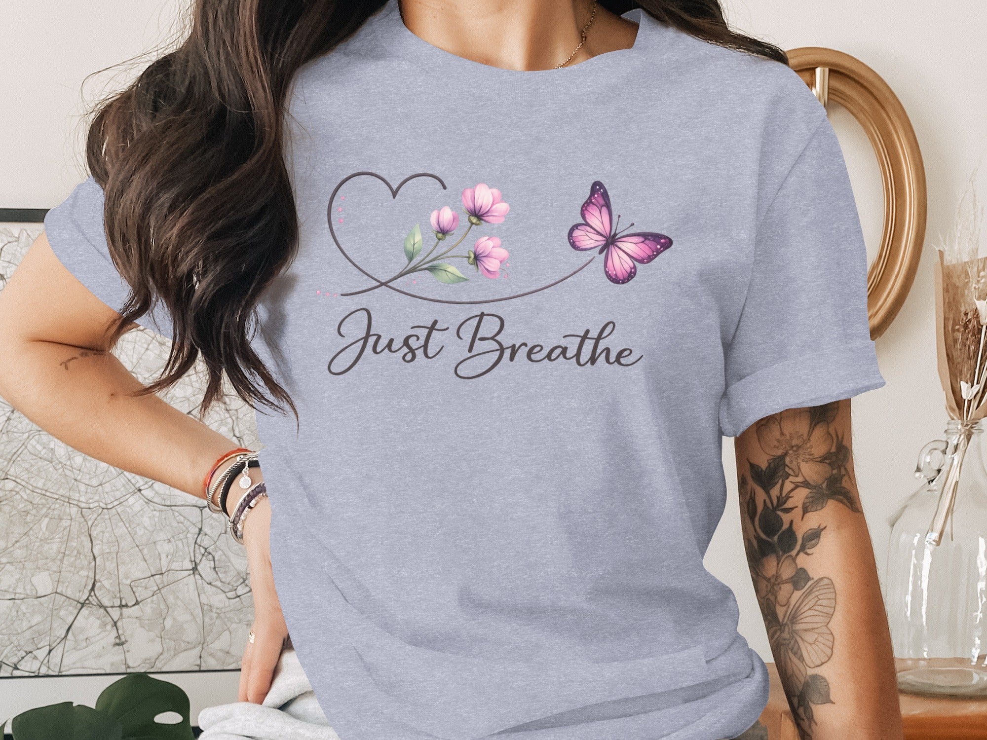 Light grey t-shirt with a heart, pink flowers, butterfly, and "Just Breathe" text.