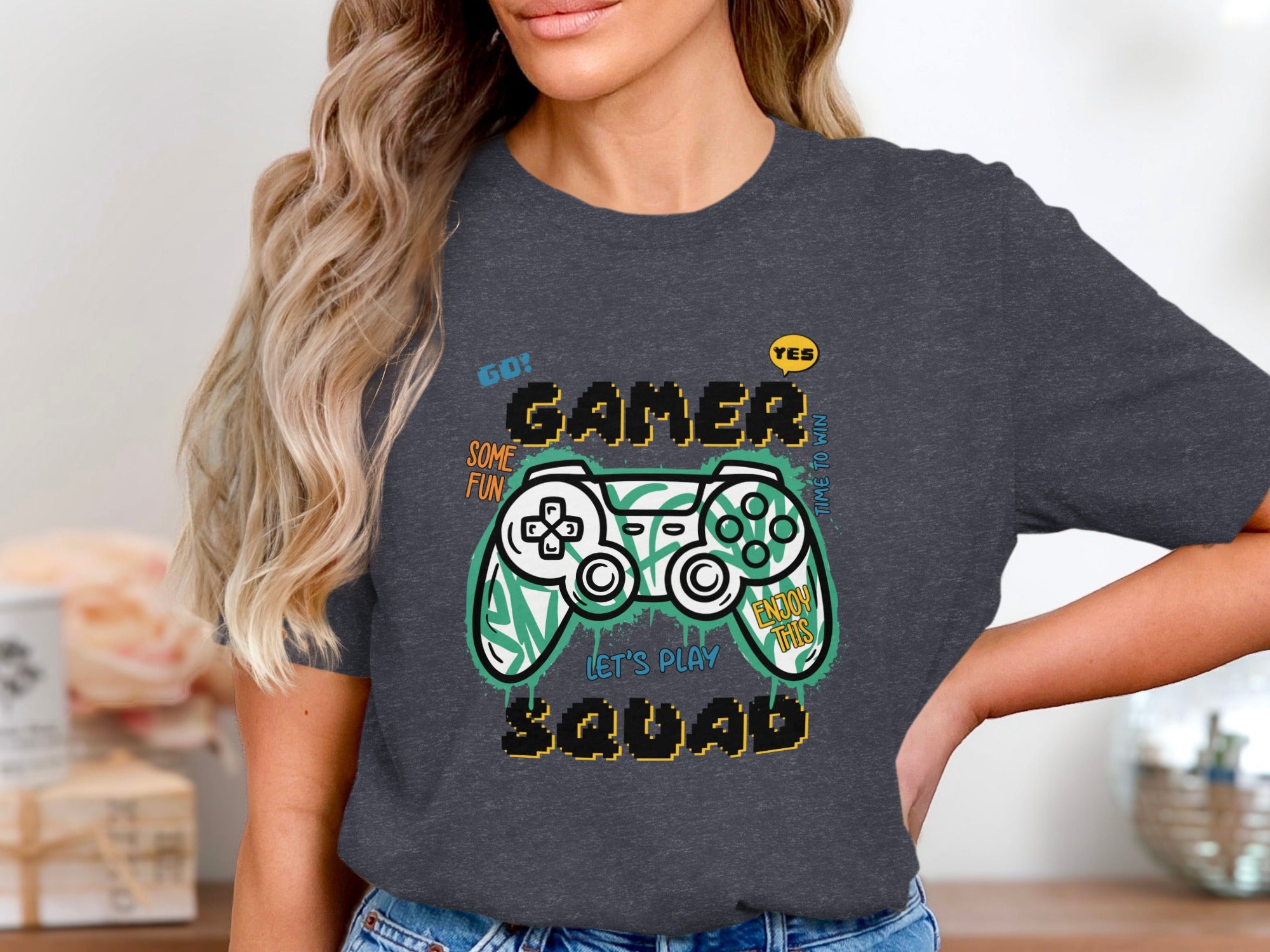 Dark gray t-shirt with gamer controller graphic and text.