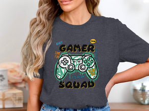 Dark gray t-shirt with gamer controller graphic and text.