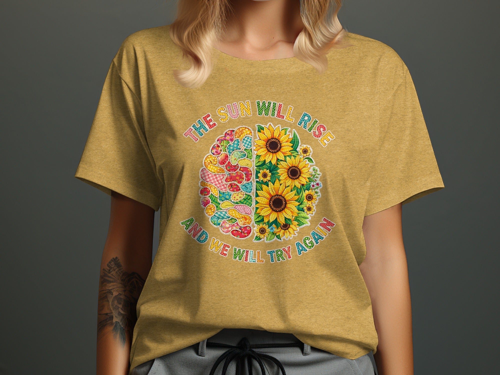 Yellow t-shirt with half brain and half sunflowers design and text.