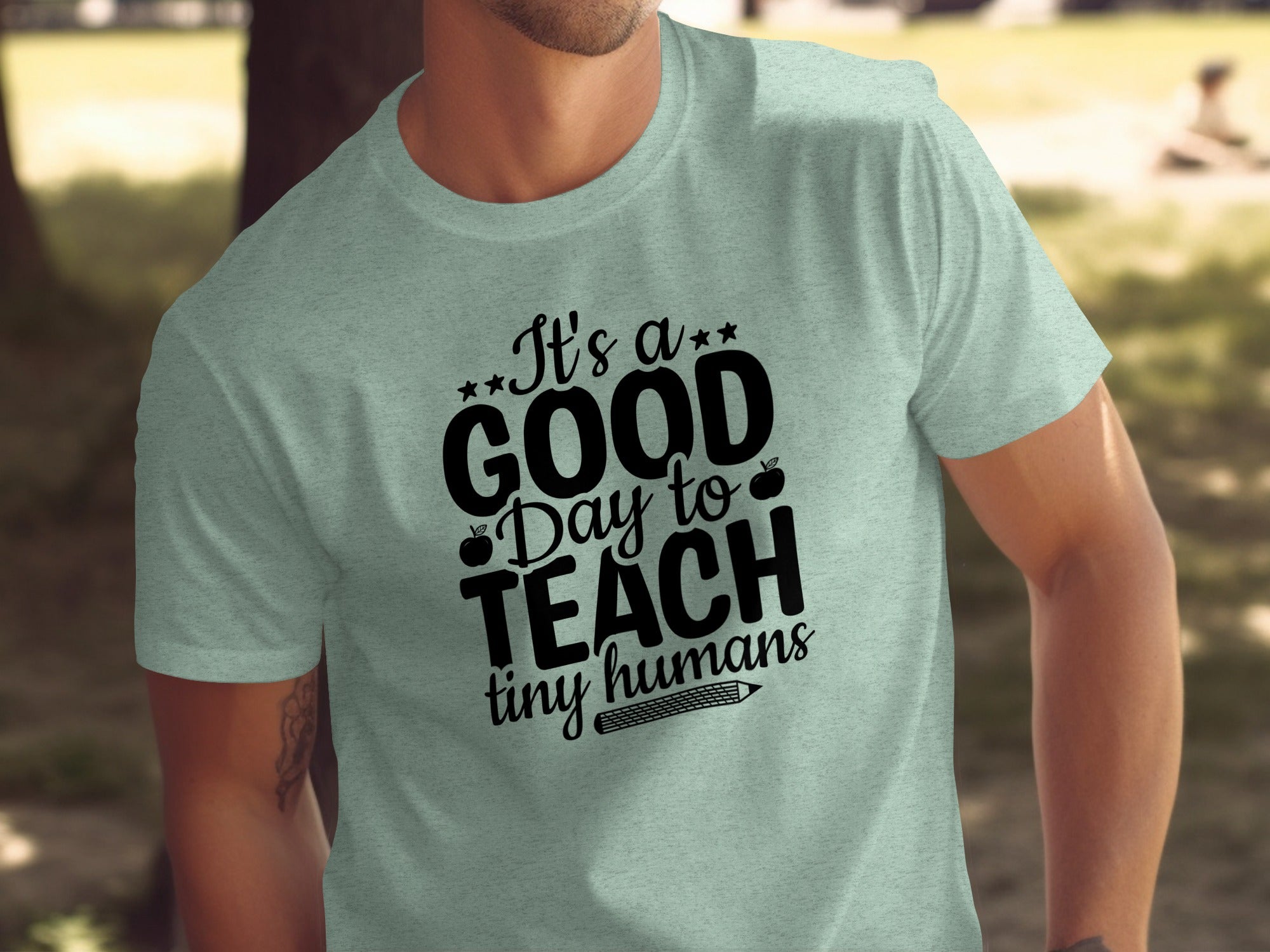 Light blue t-shirt with black text "It's a GOOD Day to TEACH tiny humans."