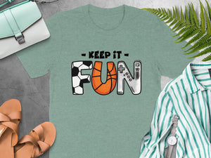 Green t-shirt with "Keep It Fun" text and icons of sports and gaming.