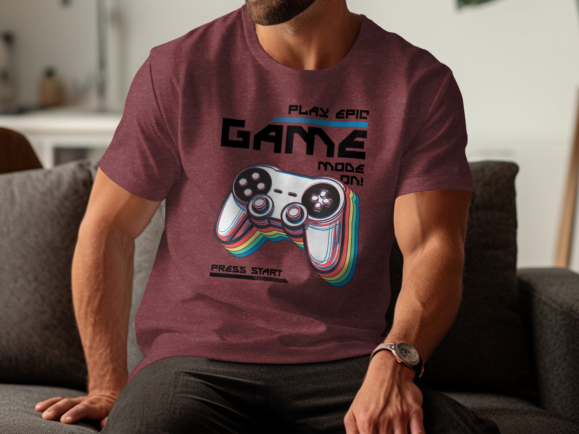 Maroon t-shirt with "PLAY EPIC GAME MODE ON!" and a colorful controller design.