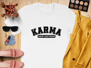 White t-shirt with black "Karma Coming Back Around" text and surrounding accessories.