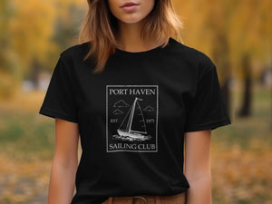 Black t-shirt with white Port Haven Sailing Club graphic and sailboat icon.
