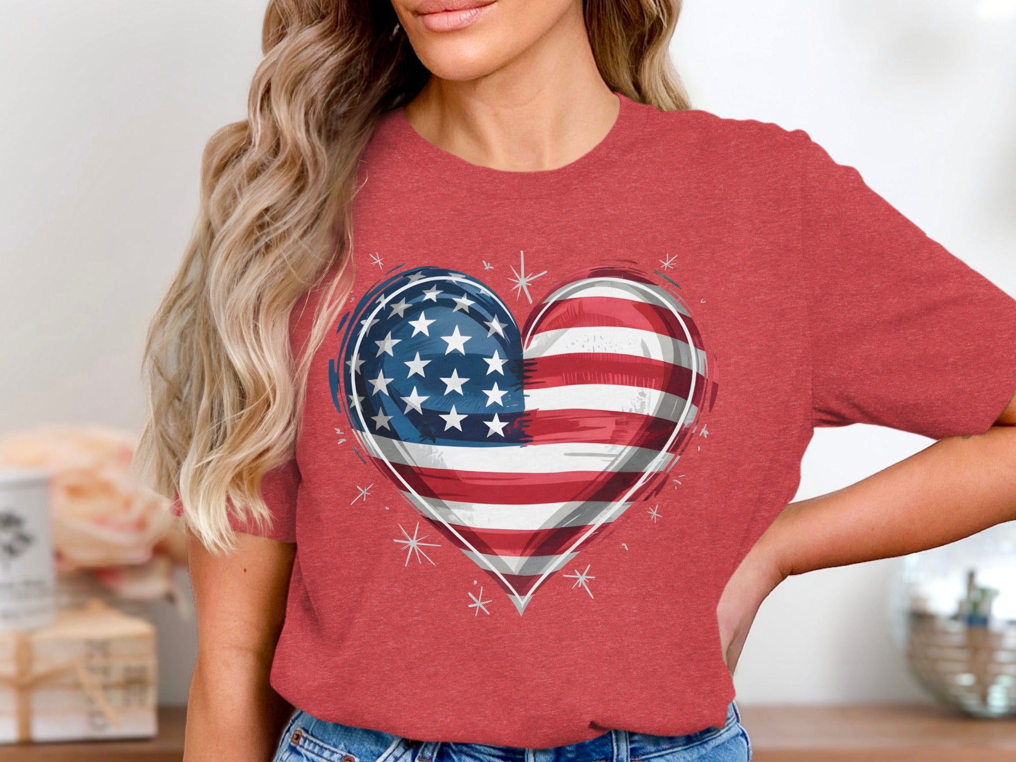 Red t-shirt with an American flag heart graphic and white sparkles.
