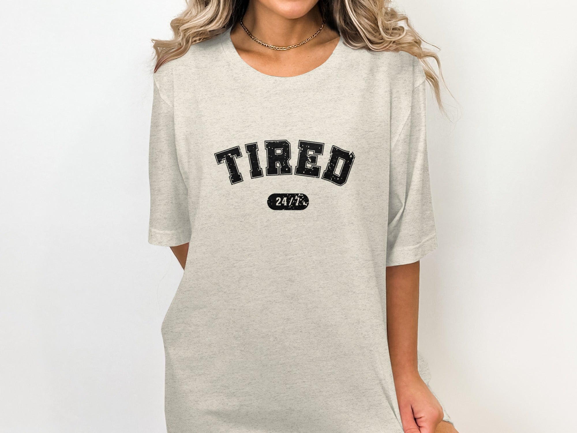 Light grey t-shirt with distressed black text reading "TIRED 24/7".